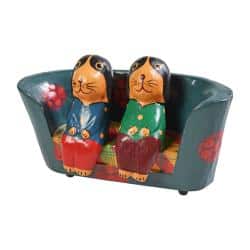 2 Dogs on a floral sofa hand carved from Albesia wood, 15 x 8 x 4cm